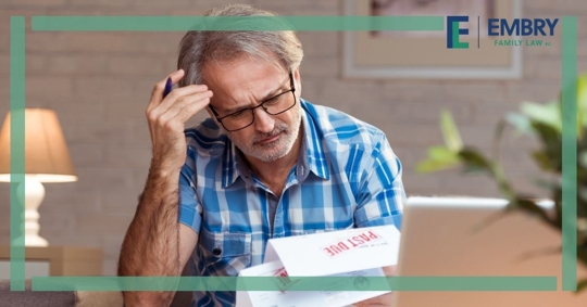Man looking stressed at documents